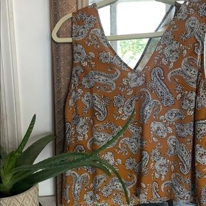 Mustard colored tank top with paisley design